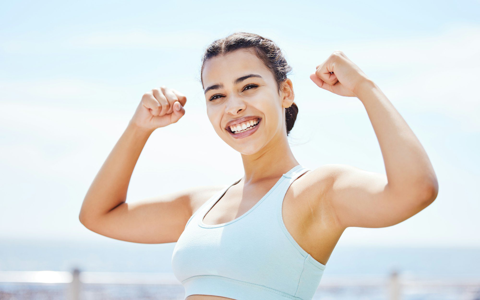 Exercise, goal and fitness success by sports woman hands in celebration of win and victory in a cit
